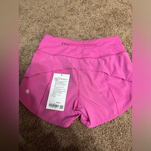 Used Pink lululemon shorts speed up mid rise shorts 4” lined size 2
